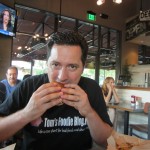 Tom eating lots of Deemer's Burgers