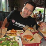 Tom eating lots of Deemer's Burgers