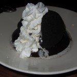 I forget the name of this dessert but it had a scope of Ice Cream that was wrapped around warm chocolate cake and topped with cream.