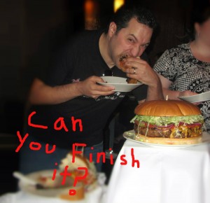 Tom from Tom's Foodie Blog Attempting to eat J.T. Schmid's Badder Asser Burger Tom from Tom's Foodie Blog Attempting to eat J.T. Schmid's Badder Asser Burger