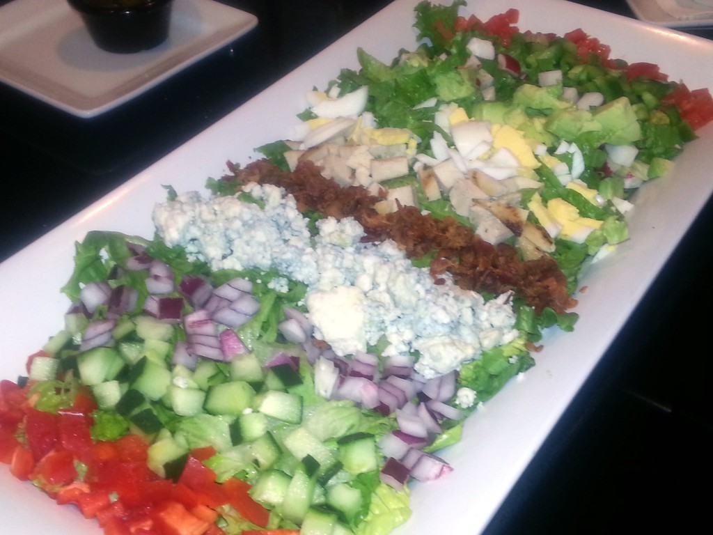 A nice take on a Cob salad with Tomoatto, peppers, avocado, bacon, onion, chicken, blue cheese