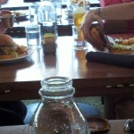 The Tables are made of reclaimed wood and water is served in milk bottles