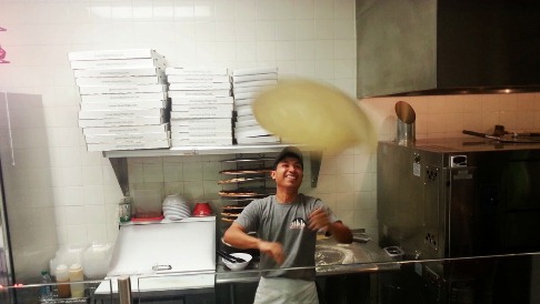 Johnn'y New York Pizza tossing dough