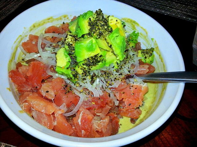 After the dressing is made, place the tuna, onions, extra avocado and furikake on top and gently fold it into the sauce