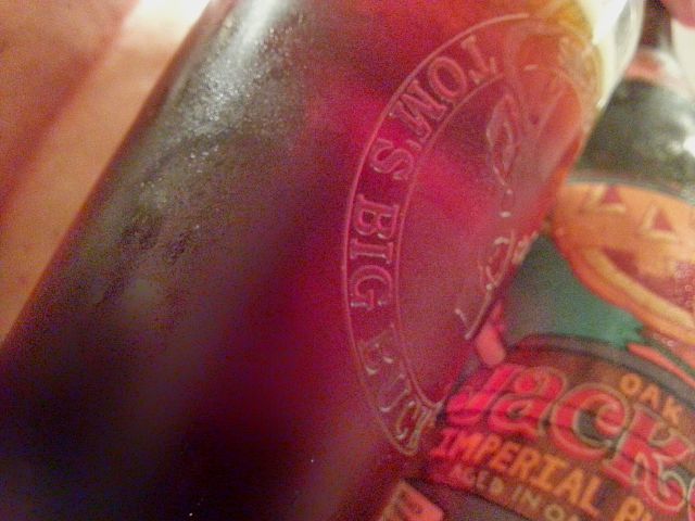 Pouring the Oak Jacked Imperial Pumpkin Ale against light