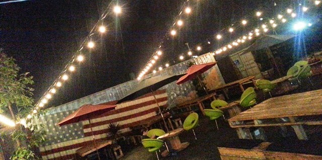 The boathouse Collective Patio at night