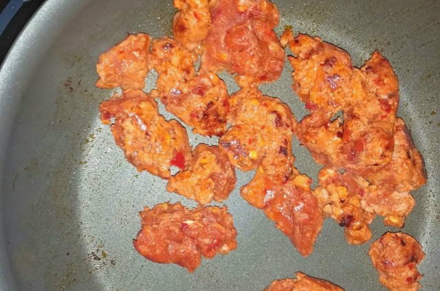 Ochoa's Chorizo cut open and cooking no excess oil