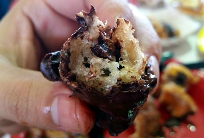 OC Fair Food 2015 Chocolate Covered Pork Rinds cut open from bacon-a-fair OC Fair Food 2015 Chocolate Covered Pork Rinds cut open from bacon-a-fair