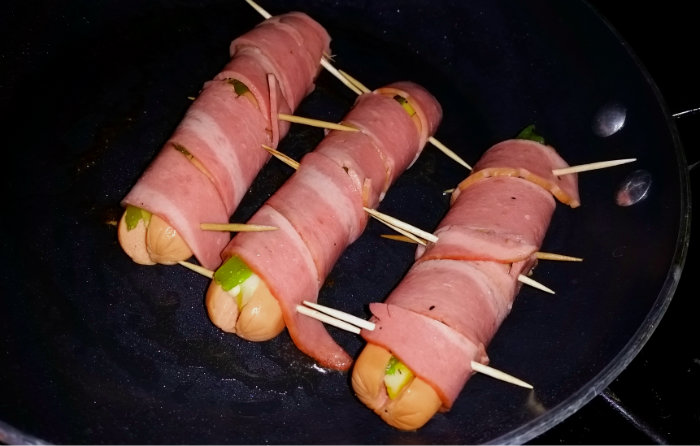Recipe Bacon Wrapped Hatch Chili Cheese Dog -Wrap Hot Dogs in Bacon and Secure with sticks
